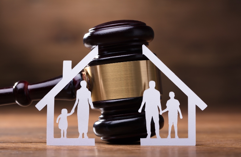 family figures from paper and judge gavel
