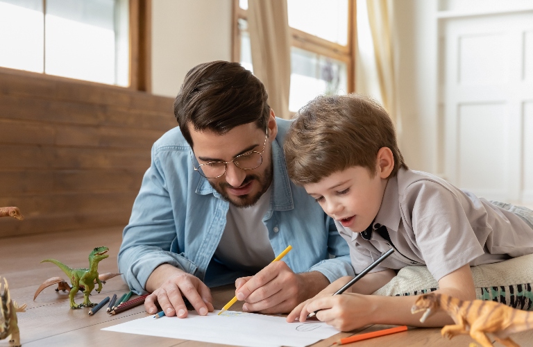 father is drawing with his son